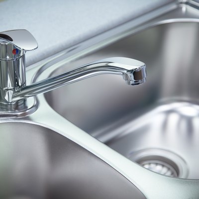 Clean chrome tap and  washbasin