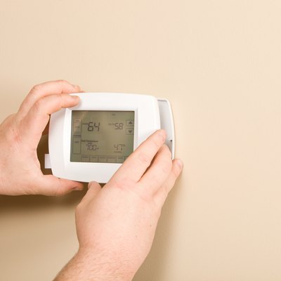 Electrician Installing New Programmable Thermostat