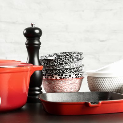 Cookware set: Red enameled cast iron pot, saucepan and bowls