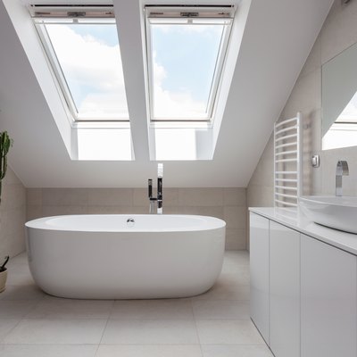 Freestanding bath in white bathroom