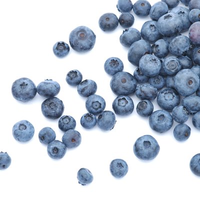 Blueberries scattered on white background