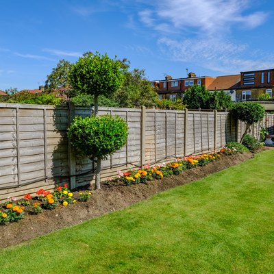 Backgarden flower bed with fence
