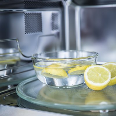 A method of cleaning in a microwave oven with water and lemon