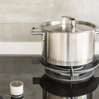 Gas stove and stainless steel pot in kitchen