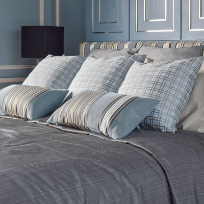 Light blue bedroom with pattern and texture of bedding