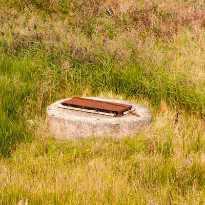 sewer bunker grate top in field country