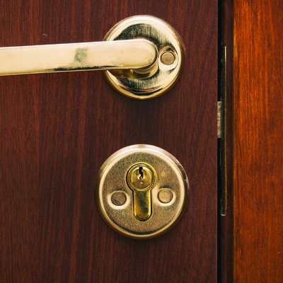 Door handle gold color with a lock
