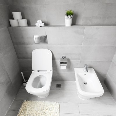 White ceramic bidet and toilet at luxury bathroom