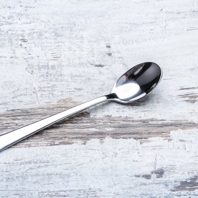 Long macchiato silver spoon on the table