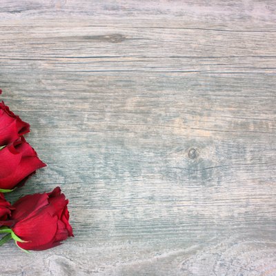 Valentine's Day Red Roses Over Wood Background