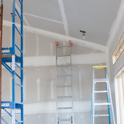 Drywall Taping, Scaffold, and Ladders in New Home Under Construction