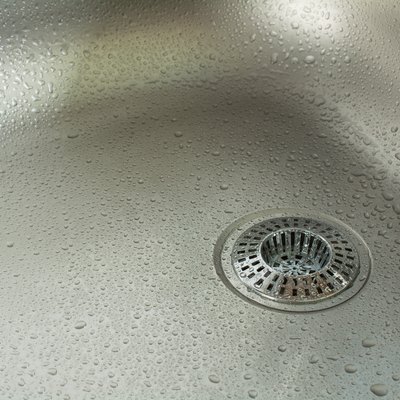 Sink With Waterdrops And Chrome Drain Strainer