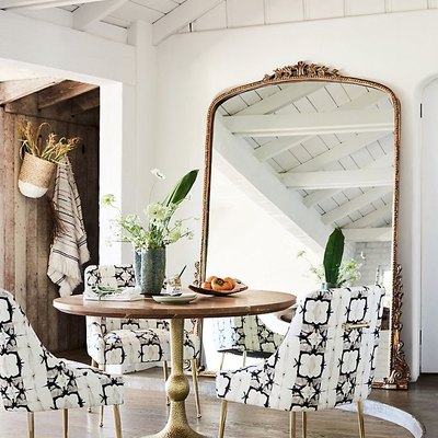 arch crown top mirror in dining room