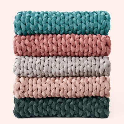 stack of woven blankets