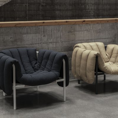 two puffy lounge chairs in black and tan