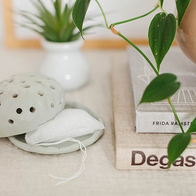 The mint green color of this organic-shaped diffuser gives it style and sophistication.