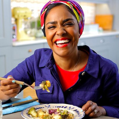 woman laughing and eating