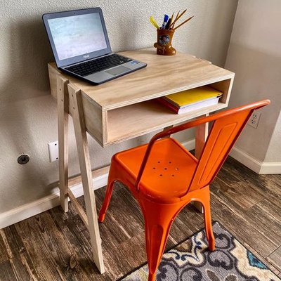 wood desk with orange chair