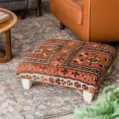Learn how to make your own ottoman using a vintage rug.