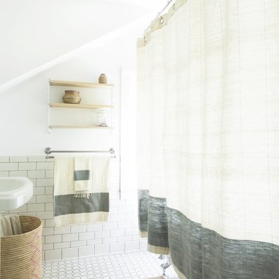Coastal shower with linen shower curtain in white and blue