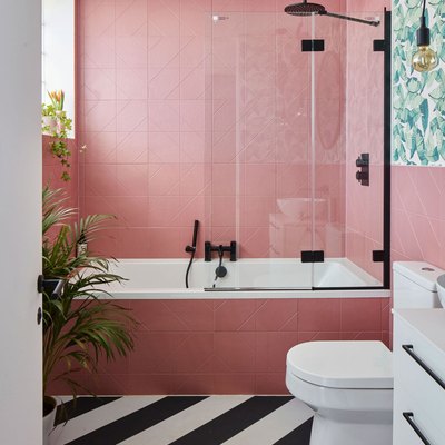 modern bathroom with pink tiles and black and white floors