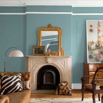 Benjamin Moore’s color of the year Aegean Teal in living room with fireplace