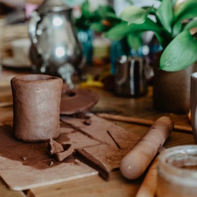 Pottery plants and mugs on a table