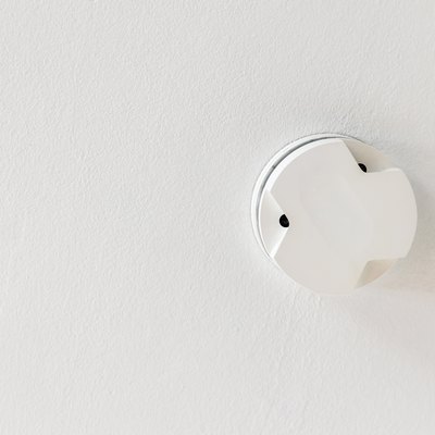 Smoke detector on a white ceiling