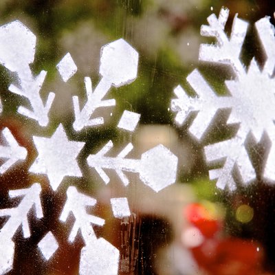 Stenciled Snowflakes On Window Glass