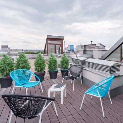 Rooftop terrace with modern chairs