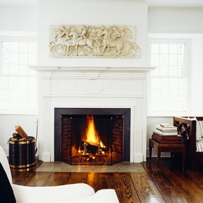 Front view of fire lit in living room fireplace