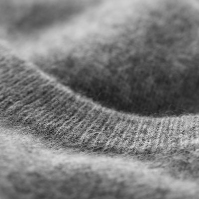 Gray cashmere sweater (detail).