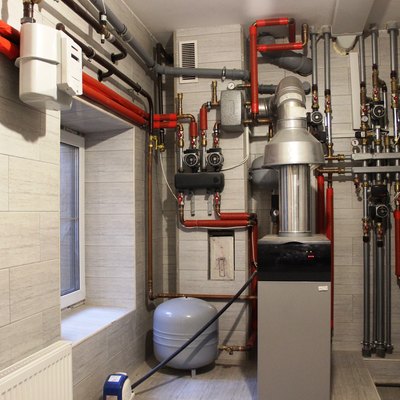 Boiler, water heater, expansion tank and other pipes. Autonomous heating system in the boiler room.