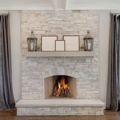 Stone fireplace with wood mantel