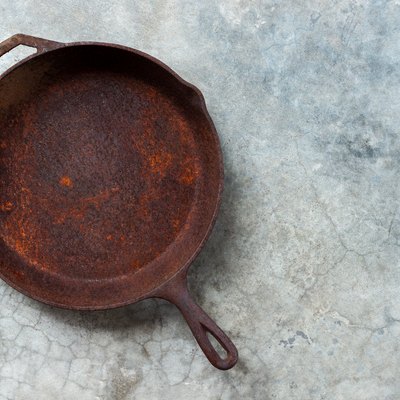 Rusty cast iron frying pan.