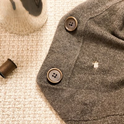 Sewing tools: repairing a hole in a sweater.
