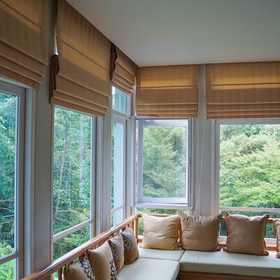 Roman shades in living room or enclosed porch