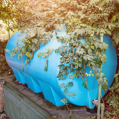 Blue water tank in a garden