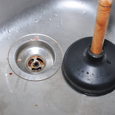 Plunger and kitchen sink.