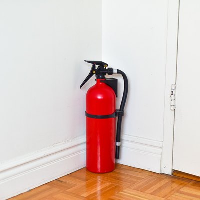 Fire Extinguisher Sitting in Corner of Home