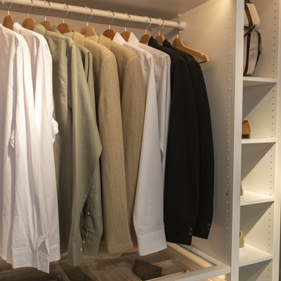 Open closet with shirts