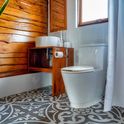 Old meets new modern bathroom with wood paneling wall