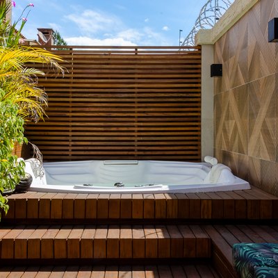Wooden deck with hot tub.