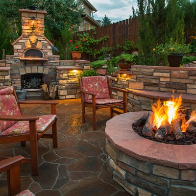 Backyard with firepit and pizza oven.
