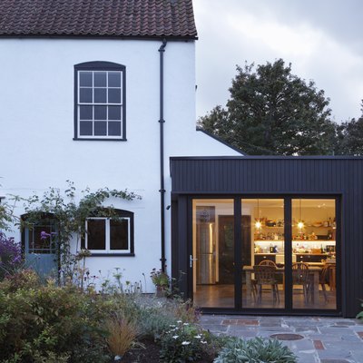 Modern extension built onto the side of a listed period property.