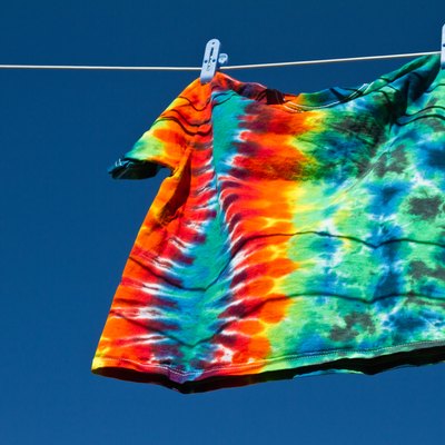 Tie-dye T-shirt hanging on clothes line.