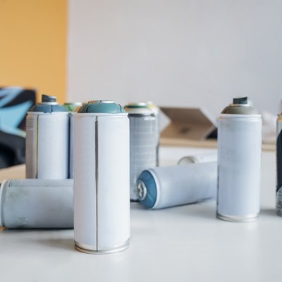 Aerosol spray paint can on table in studio