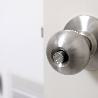 Stainless steel push-button doorknob.