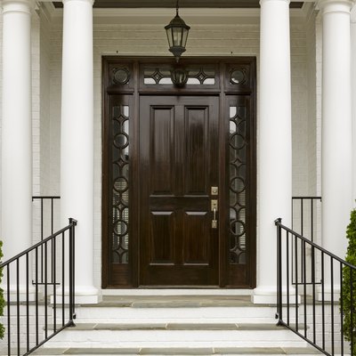 Dark front door with white columns