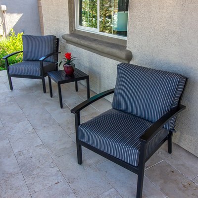 Front Patio With Small Table & Two Arm Chairs With Striped Cushions